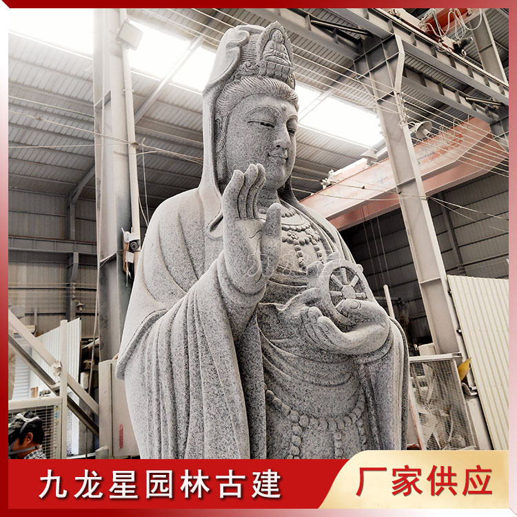 1654740991876270.jpg 石雕觀音像手托法輪圖片/